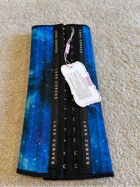 New in package Luxx Curves Waist Trainer size medium, long torso, galaxy pattern